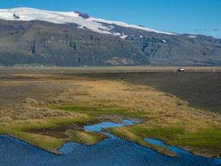 Car driving on the Ring Road in Southern Iceland near Svinafellsjokull glacier