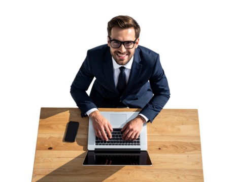  A confident businessman wearing glasses, smiling as he works on a laptop placed on a