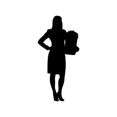 Full-length silhouette of a confident businesswoman holding a bouquet of flowers.