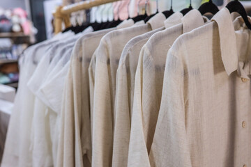 Shirts hanging on a rack in a clothing store