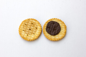 A golden brown biscuit on a white background.