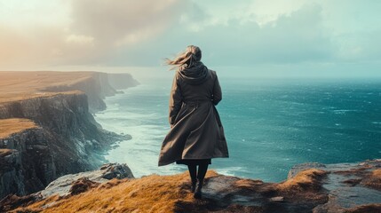 Woman Contemplating the Dramatic Coastal Cliffs