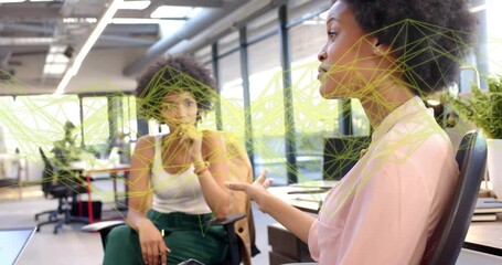 Team sharing business ideas with animated charts while woman dialing smartphone calling client - Powered by Adobe