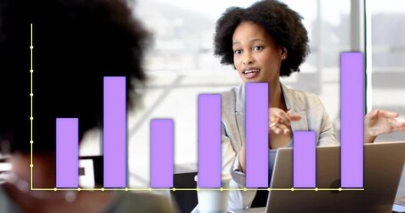 Businesswoman showing data on laptop in business meeting, purple bars growing illustrating metrics