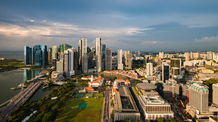 Aerial view of Singapore Marina Bay with iconic skyscrapers, Marina Bay Sands, and the financial district, symbolizing global economy, ESG, inflation impact, and sustainable growth.