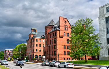 Historic Richardsonian Romanesque building with conical tower and arched entry on State Street near the Vermont State House in Montpelier, United States