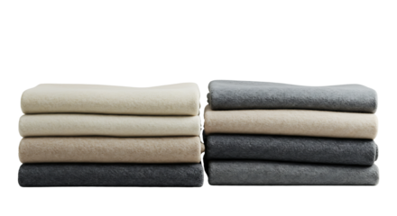Collection of neatly folded, soft, natural-toned blankets and throws, ideal for adding warmth and comfort to any cozy home living space or bedroom interior