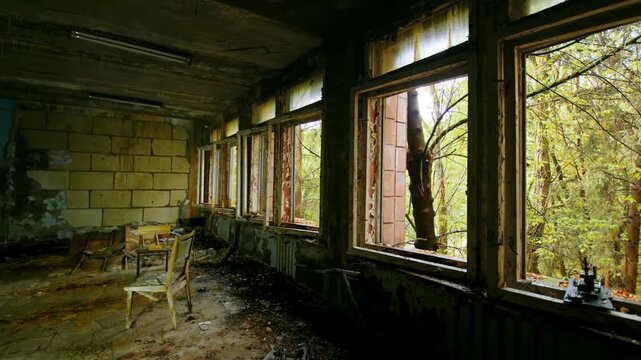 poignant view inside an abandoned school classroom in Pripyat, Ukraine, within the Chernobyl Exclusion Zone. This footage captures the silent decay and historical significance of the ghost city, a tes
