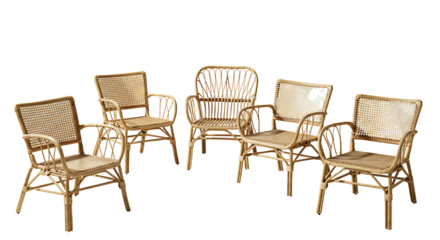 A collection of five natural wicker armchairs arranged in a studio setting against a white background