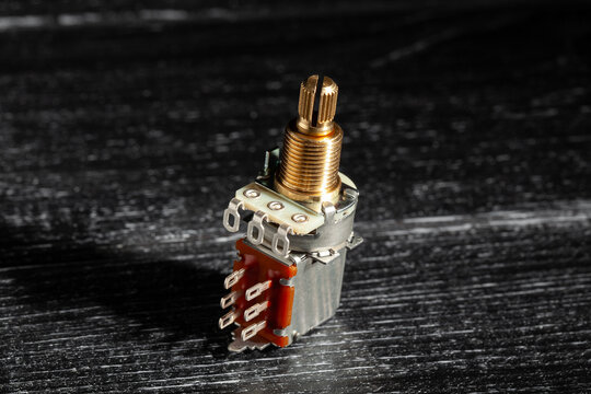 guitar push pull potentiometer on black wood background