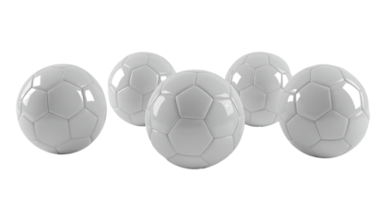 A collection of white soccer balls arranged on a clean white background, highlighting their iconic design and geometric pattern