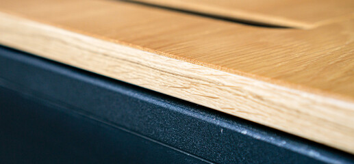 Empty rough wooden table top in the dark room