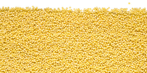 Millet grains forming a textured background on transparent surface