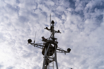 low angle view of the ship tower against the cloudy sky