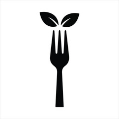 Organic food concept fork with green leaves symbolizing healthy natural cuisine and nutrition