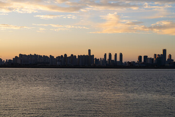 Fototapeta premium seaside city in dusk during sunset