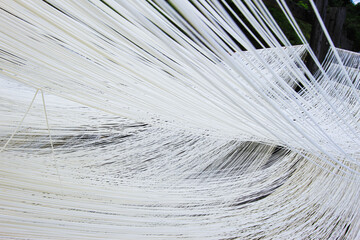 Handmade somen noodles, a traditional food from Huatan Township, Changhua County, Taiwan, are hung to dry in the sun.