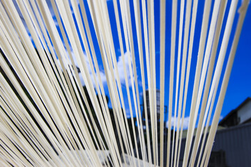 Traditional handmade white noodles drying in a courtyard at Huatan Township, Changhua County, Taiwan, showcasing authentic local craftsmanship.