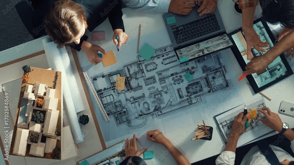 Poster top aerial view of project manager or civil engineer writing at blueprint and planning building desi