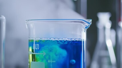 Two-color liquid in a beaker - Powered by Adobe
