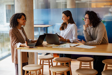 In a vibrant office environment, professionals engage in a stimulating and creative discussion together