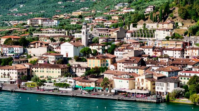 Limone sul Garda old town. Aerial 4K video footage of panoramic lake Garda and Italian Alps mountains. Lombardy drone landscape of downtown