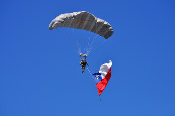 Military Parade, paratrooper waving the Chilean flag, National Holidays in Chile