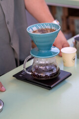 barista quick filter coffee brewing close up