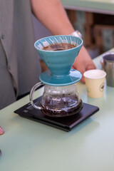 barista quick filter coffee brewing close up