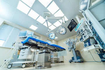 Operating room prepared for surgery with advanced equipment. Bright surgical room ready for an operation with modern medical tools and equipment arranged methodically.