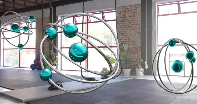 Opening revealing studio, sculpture floating, rotating as spheres drift to showcase kinetic art