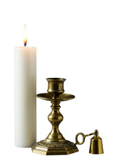 A burning white wax pillar candle in an ornate tarnished brass holder with a polished brass snuffer, isolated on a transparent studio background, elegant product presentation.