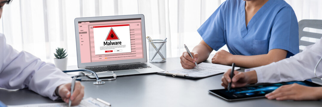 Cyber attacking concept. Malware alert showing on computer screen display scam and threat detection on computer system or online server to be removed brisk.