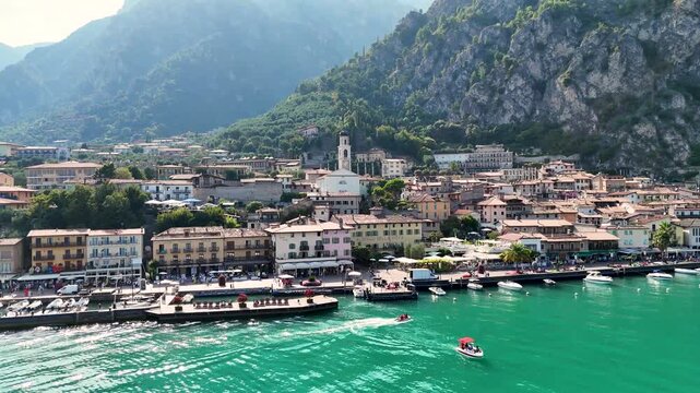 Limone sul Garda old town. Aerial 4K video footage of panoramic lake Garda and Italian Alps mountains. Lombardy drone landscape of downtown