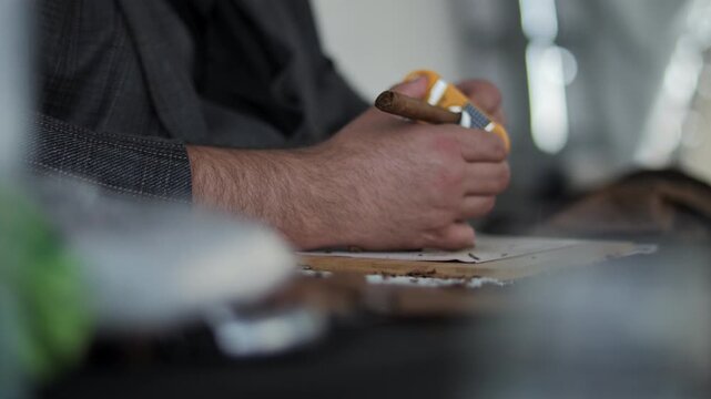 Man Cutting Cigar with Special Guillotine Cutter