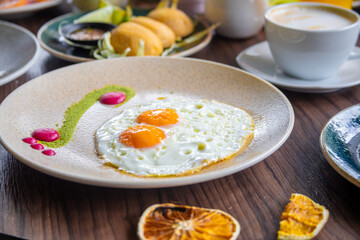 variety of breakfast items, breads, eggs, waffles, cereals, and cheeses