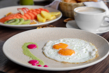 variety of breakfast items, breads, eggs, waffles, cereals, and cheeses