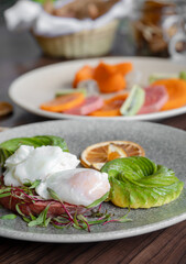 variety of breakfast items, breads, eggs, waffles, cereals, and cheeses