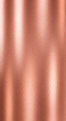 A detailed close-up view of a smooth, rose gold metallic surface with subtle, vertical textural lines.