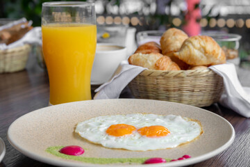 variety of breakfast items, breads, eggs, waffles, cereals, and cheeses