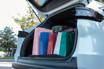 Shopping bags in the trunk of a white car