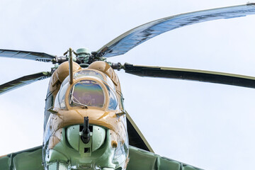 Camouflaged Soviet Mi-24 military attack helicopter in low flight © ZenitX