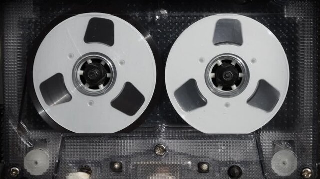 Front View of Vintage Audio Cassette Tape in Player Deck