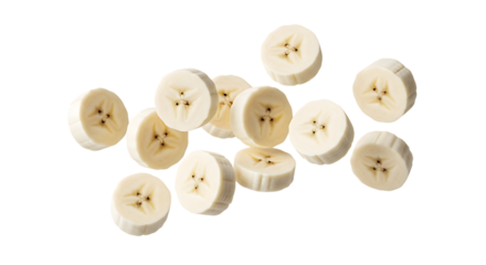 Sliced Banana Rounds Scattered on a Dark Surface fruit