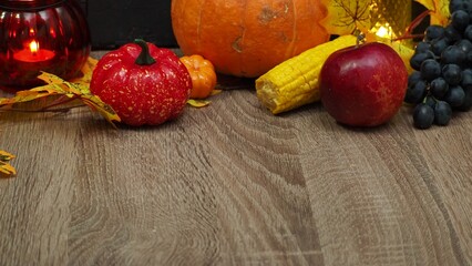 Autumn mood, harvest, pumpkin, fruits, autumn leaves on the table. a festive dinner at home. On the table there is pie and fruits, grapes, apples, pumpkin. Thanksgiving table served . Christmas dinner