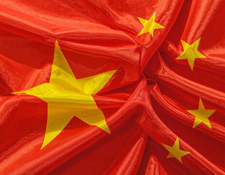 Close-up Chinese national flag with golden stars on red fabric, detailed textile texture, symbolizing patriotism, unity, and national pride.

 - Powered by Adobe