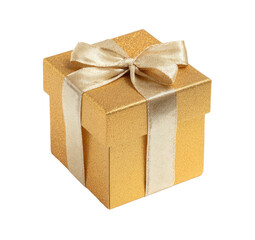 A gold gift box with a light beige ribbon