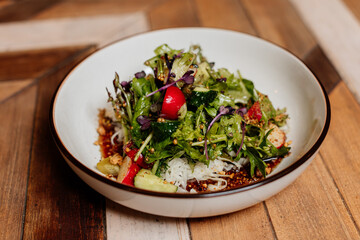 Fresh green salad with lettuce leaves. Healthy vegetarian meal close up.