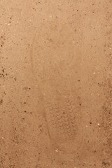 Footprint in dry sandy soil
