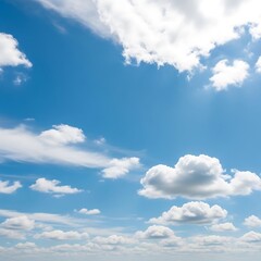 Fototapeta premium A vast expanse of brilliant blue sky, dotted with fluffy white cumulus clouds, showcases a serene and cheerful atmosphere.